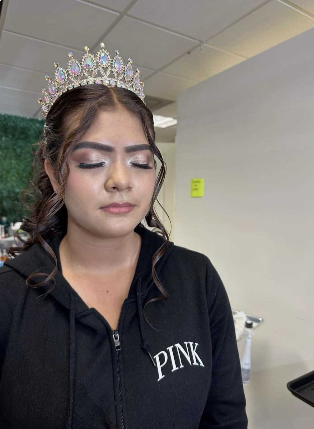 picture of girl with eyes closed and tiara on her head with make-up
