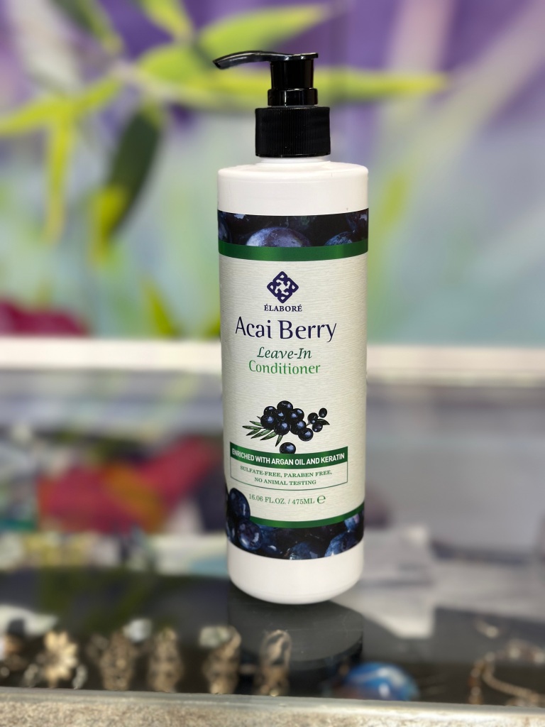 Picture of a white bottle with the words acai berry. A leave in conditioner.